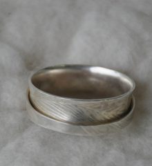 Sterling silver spinner ring with Emu feather print